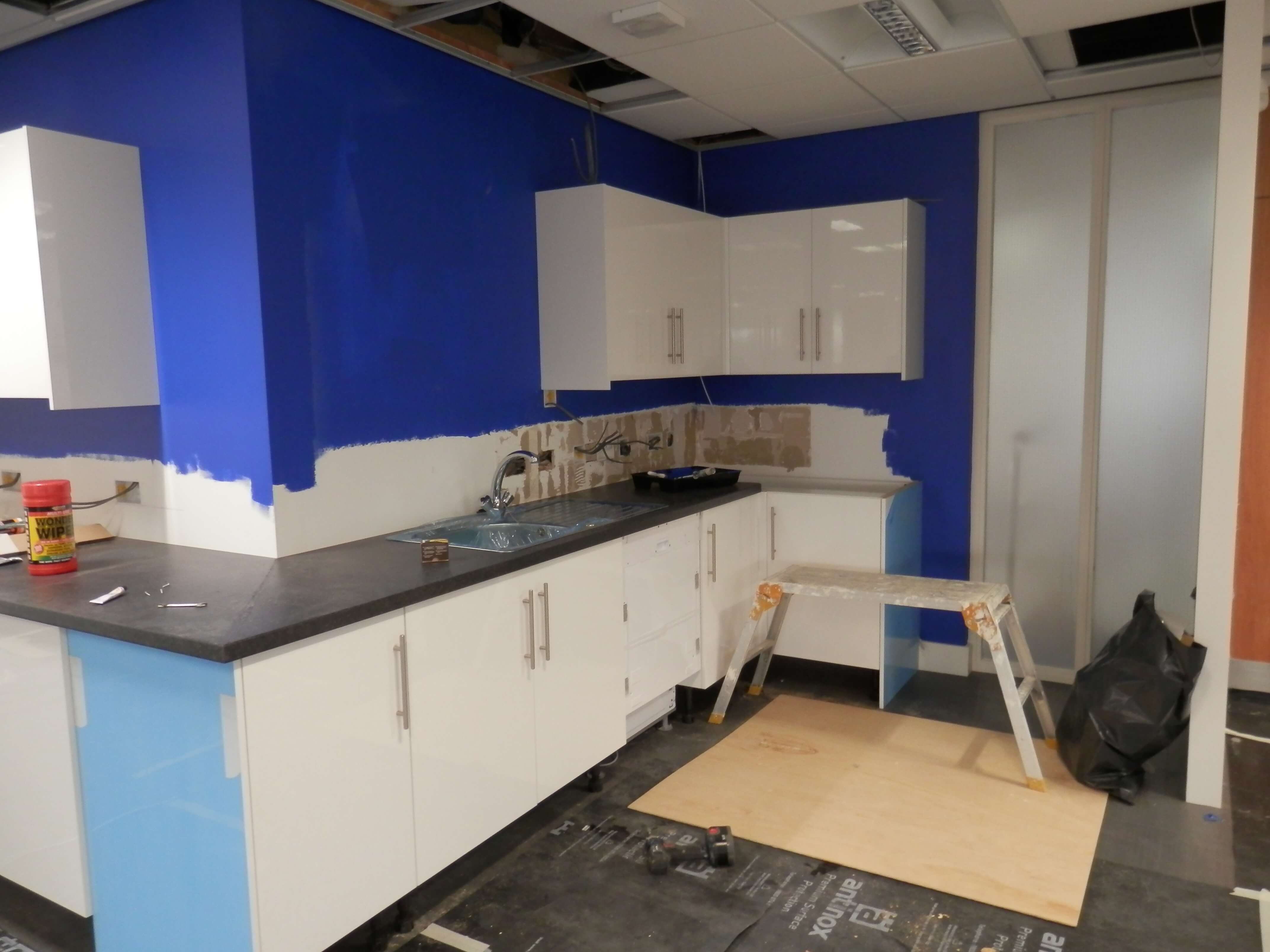 Kitchen taking shape, worktops fitted and walls painted.