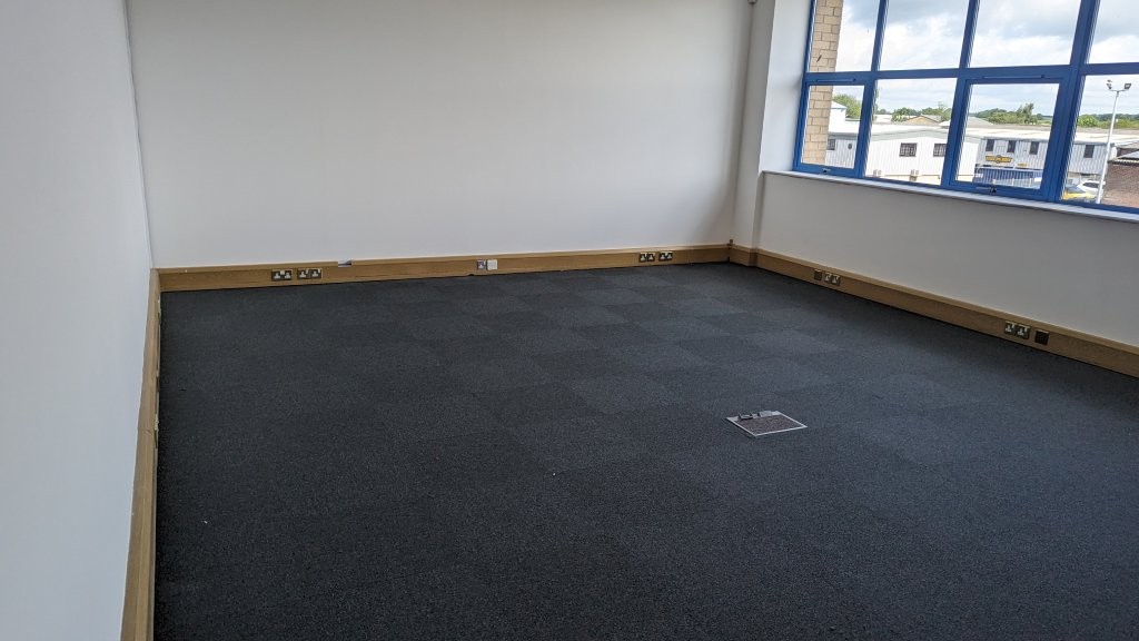 New commercial carpet installed at Fabrinet.