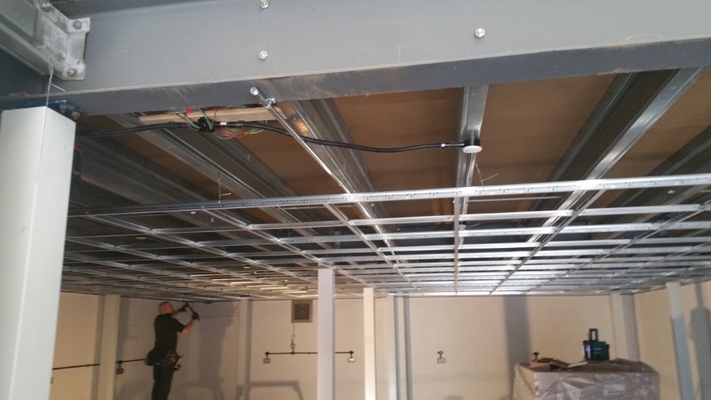 Ceiling grid being installed