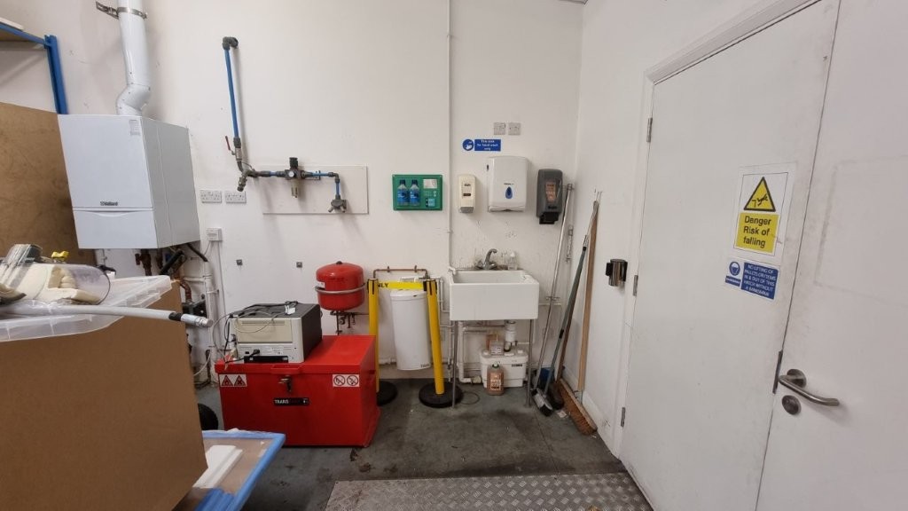 Existing boiler and plumbing to be hidden