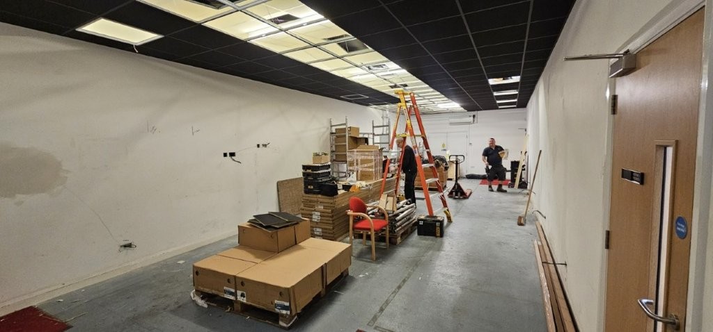 Black suspended ceiling being installed