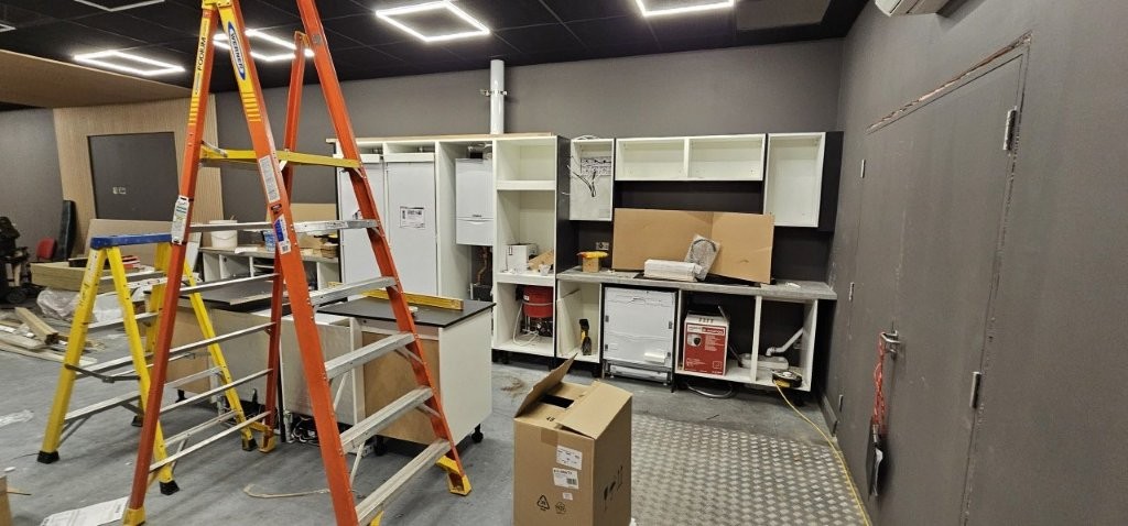 Kitchen designed to fit around the boiler and services