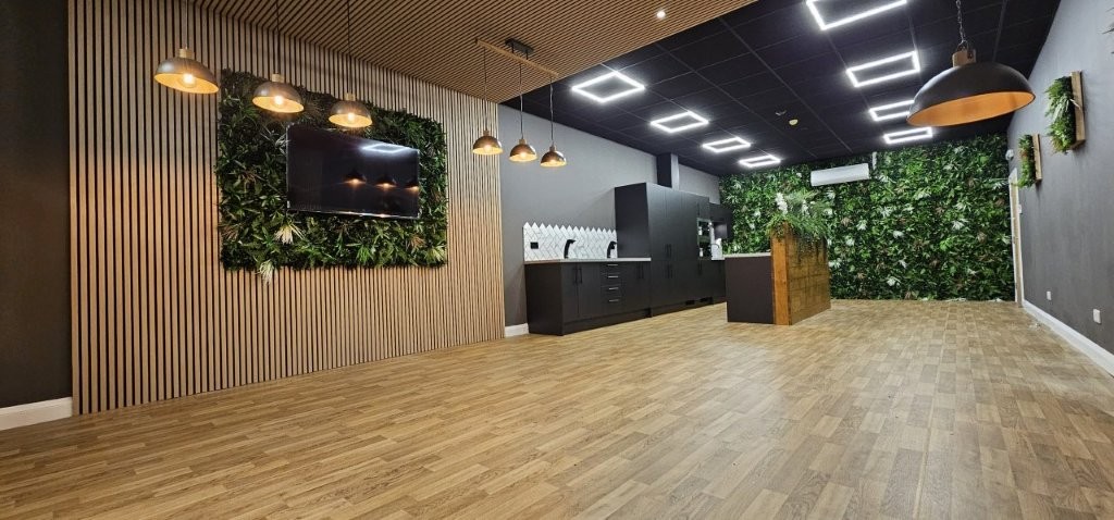 The plantwall hides a double door into the loading bay and the boiler is hidden within a larder unit