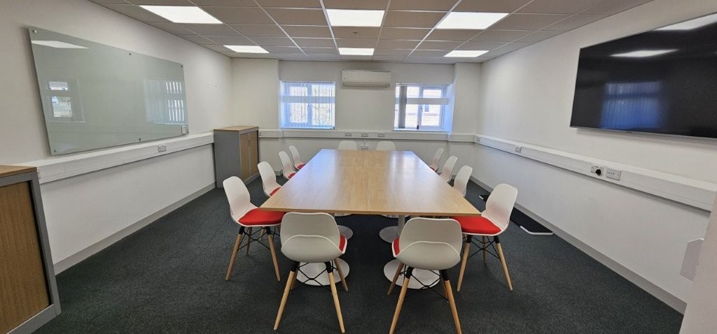 Meeting room chairs had corporate red seats with oak legs and oak worktops