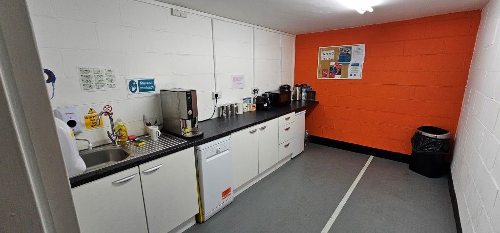 Very worn flooring and bold orange colour