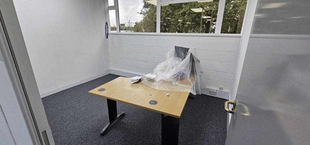 Clean white office with new grey carpet tiles