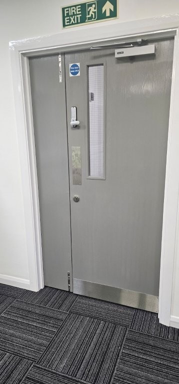 Grey doors with stainless steel ironmongery